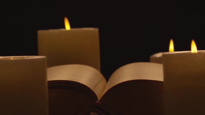 The candles all flicker together by the book
