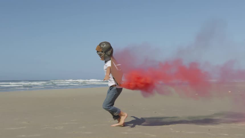Boy Running On The Beach