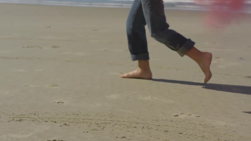Boy Running On The Beach