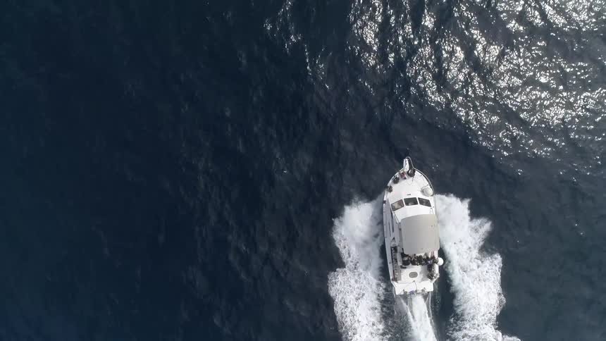 A boat is moving along the water