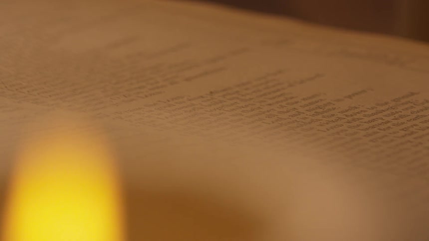 A book is displayed by a flame