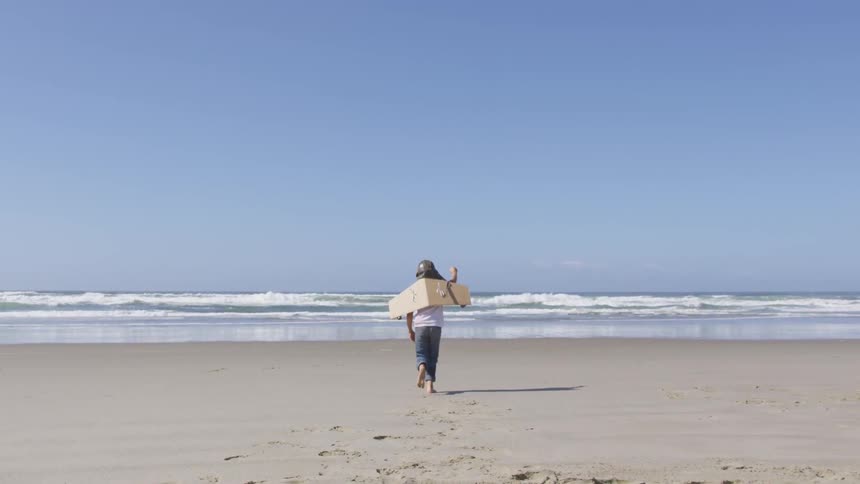 Boy Running On The Beach