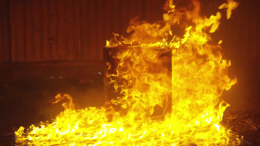 Abstract People Burning Various Objects In Warehouse