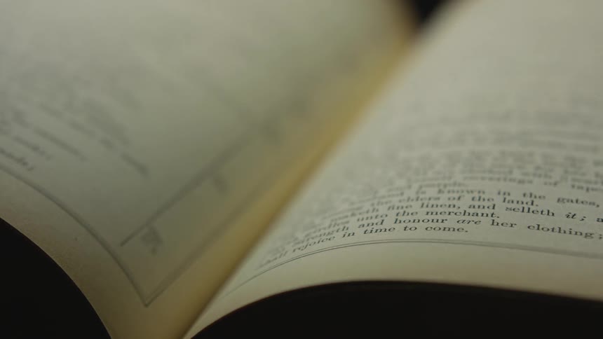 Shadow crossing over an open book
