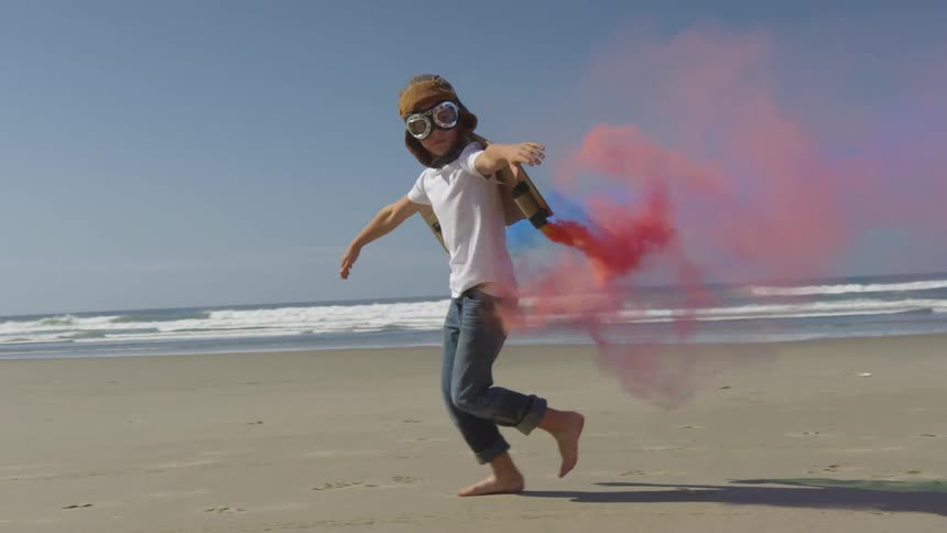 Boy Running On The Beach