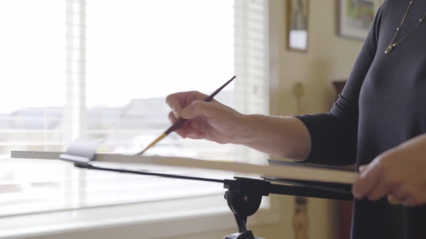 Artist Painting On Canvas