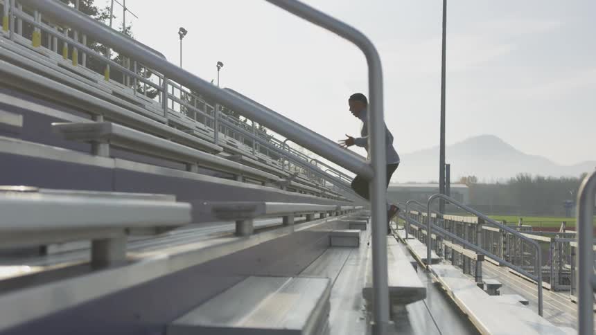 Man Exercising At Stadium