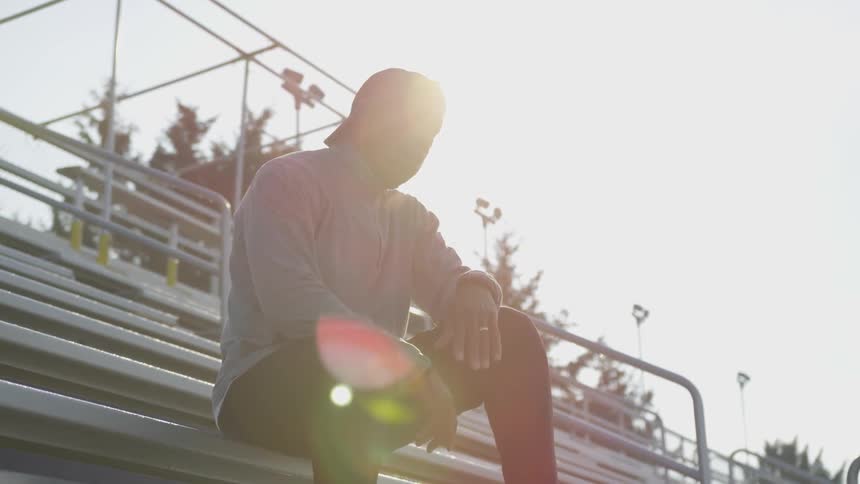 Man Exercising At Stadium
