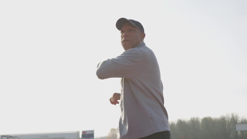 Man Exercising At Stadium