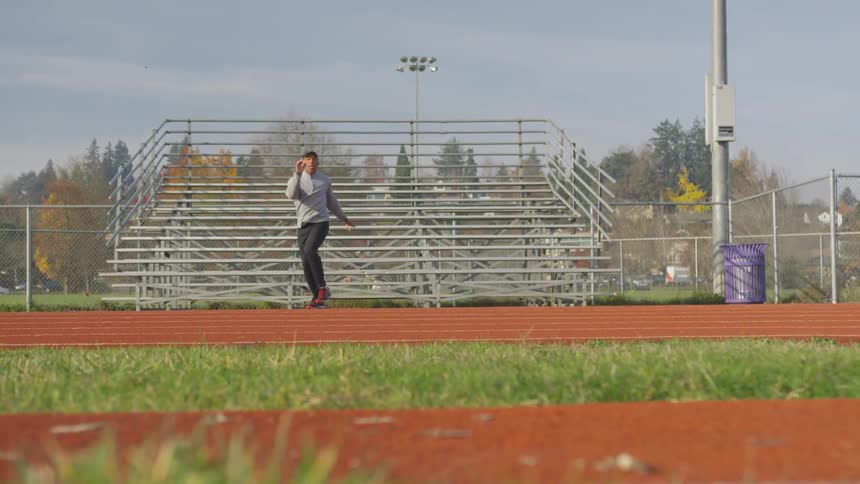 Man Exercising At Stadium