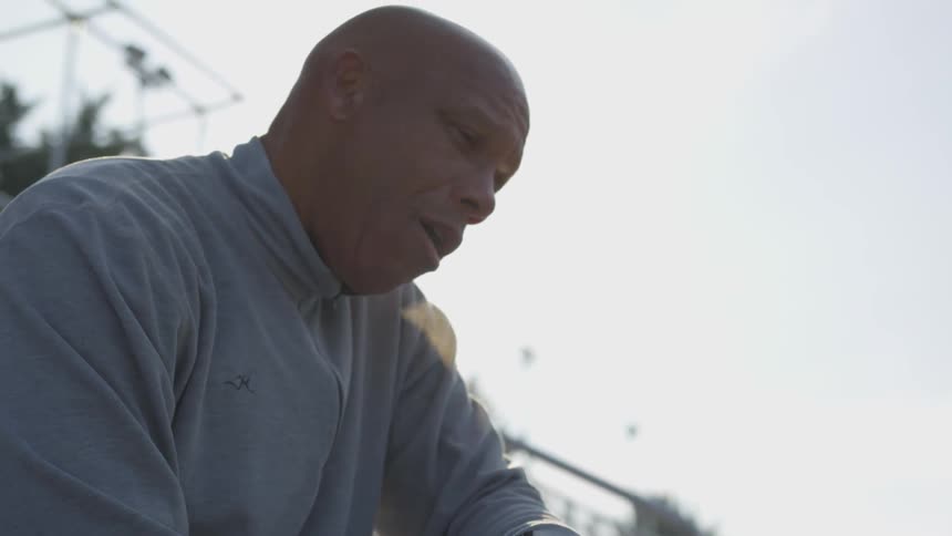 Man Exercising At Stadium