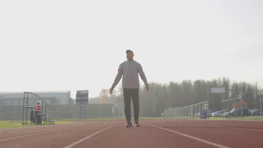 Man Exercising At Stadium
