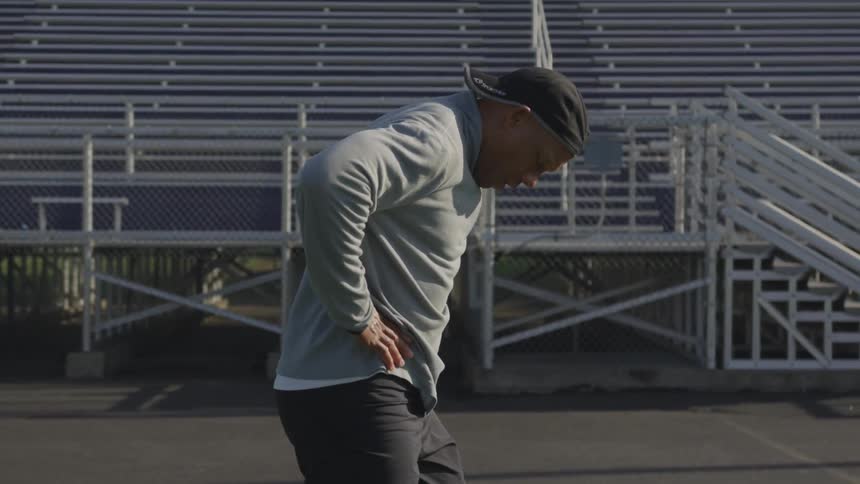 Man Exercising At Stadium