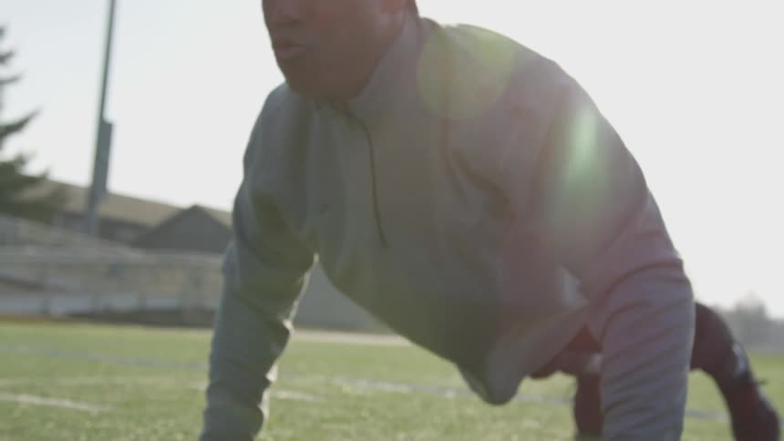 Man Exercising At Stadium