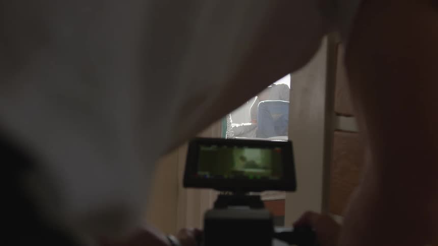 Man Filming Actors