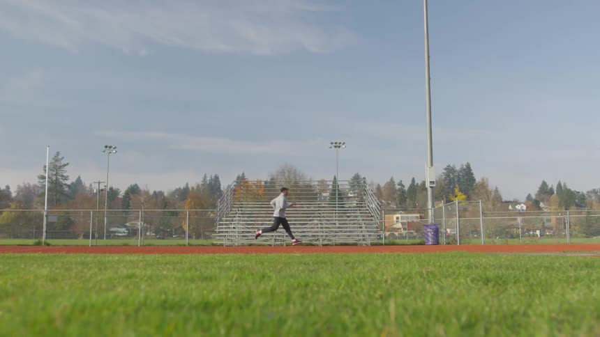 Man Exercising At Stadium