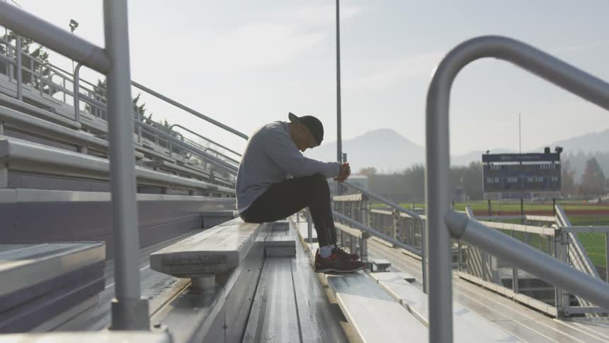 Man Exercising At Stadium