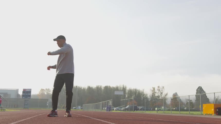 Man Exercising At Stadium