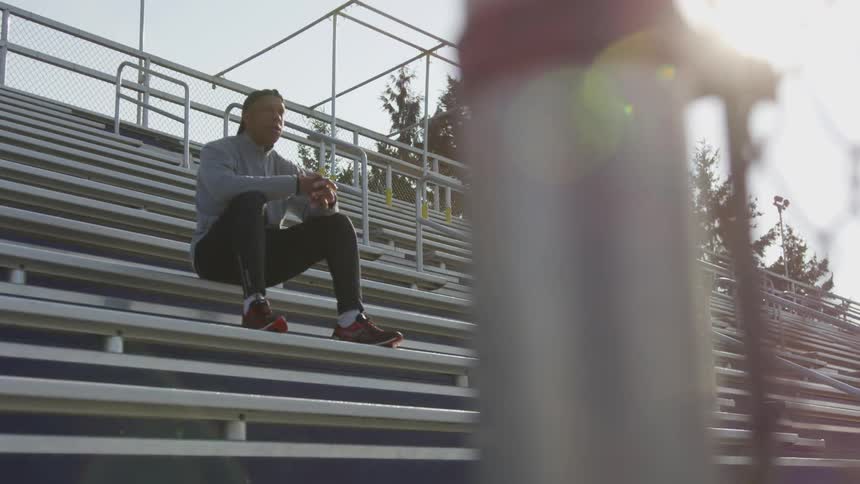 Man Exercising At Stadium