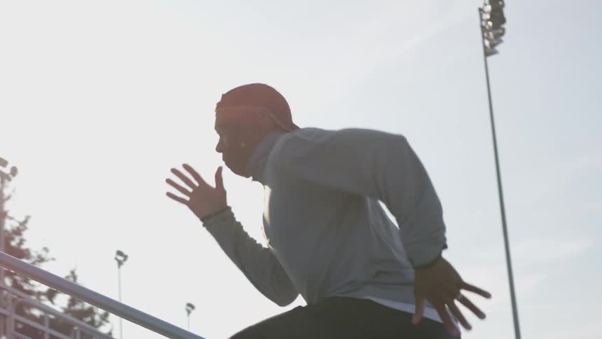 Man Exercising At Stadium