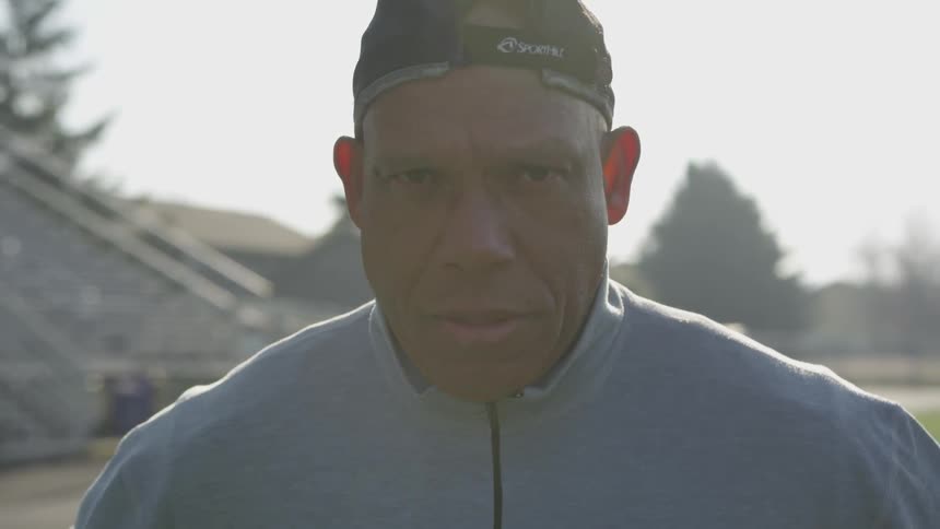 Man Exercising At Stadium