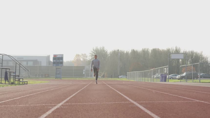 Man Exercising At Stadium