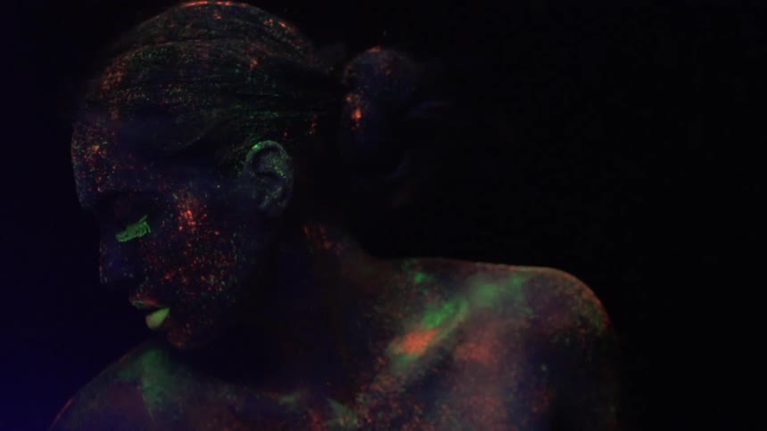 A person wearing neon paint
