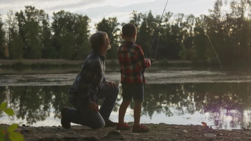 Father and son are fishing together