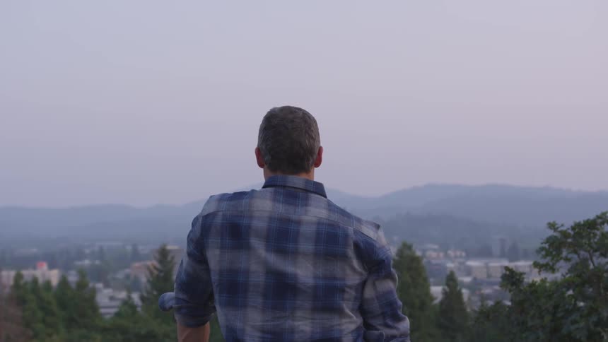 A man is looking at a view outside