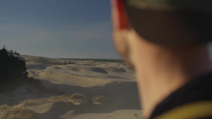 A man is looking at the horizon