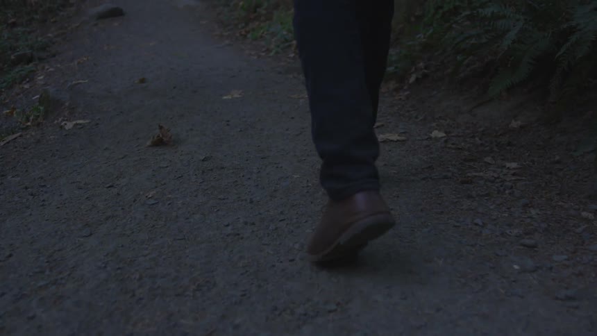 A person is walking at night