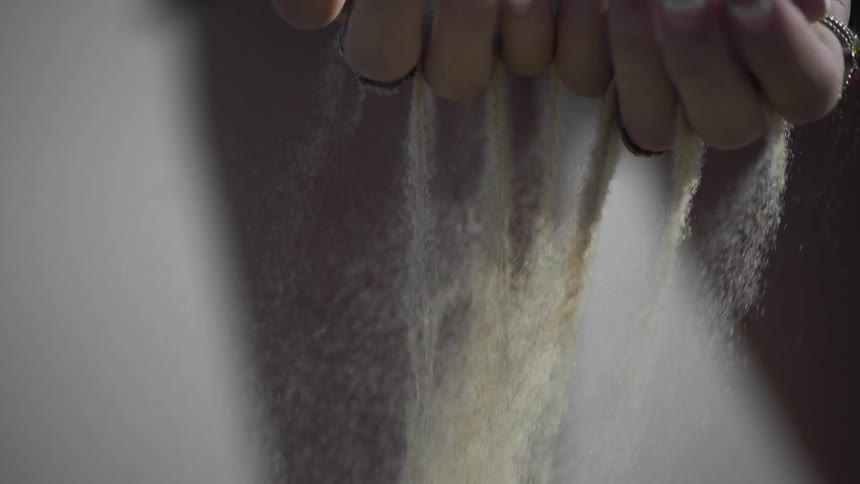 Sand running thru fingers