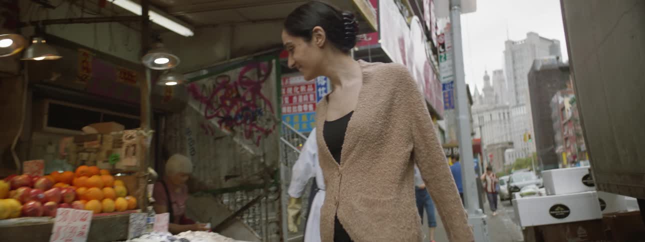 Woman Walking Through Chinatown