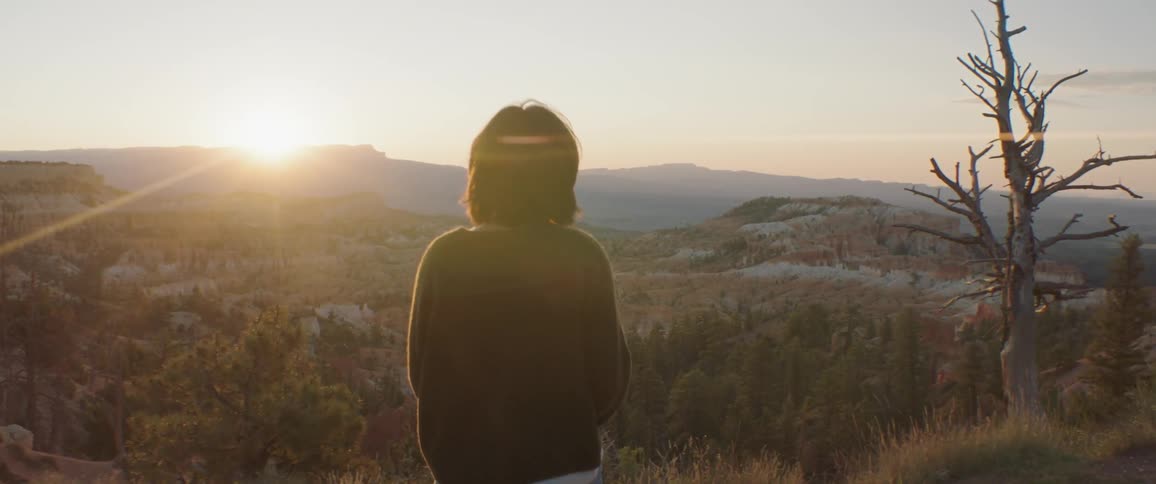 Woman Taking Photos And Exploring Overlook