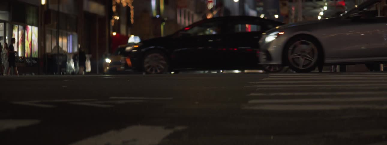 Cars driving through intersection