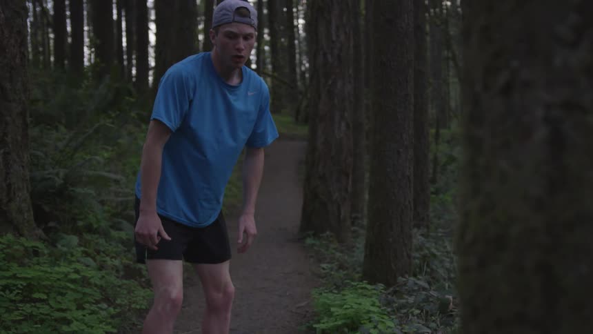 Man Jogging Through Forest