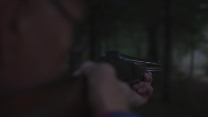 Man In Forest With Weapons