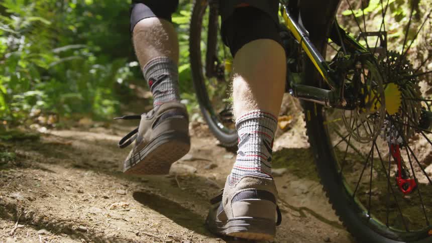 Man Mountain Biking In Forest