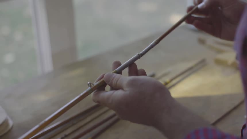 Man Making Fishing Pole