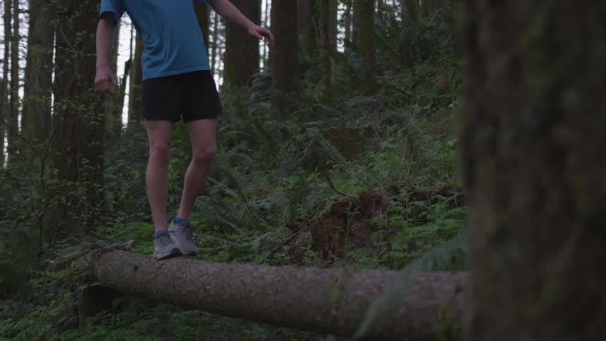 Man Jogging Through Forest