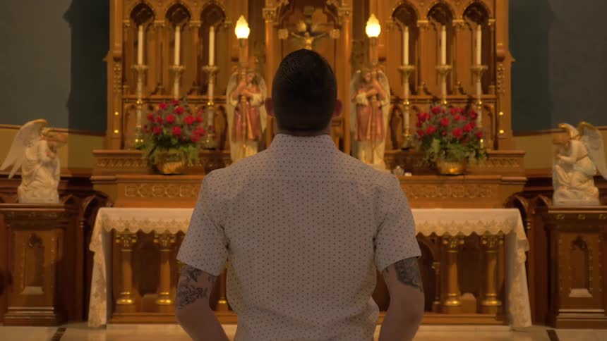 Man Praying At Church