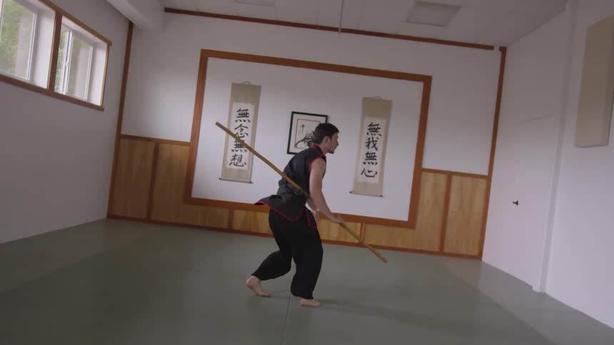 Man Practicing Asian Fighting Techniques
