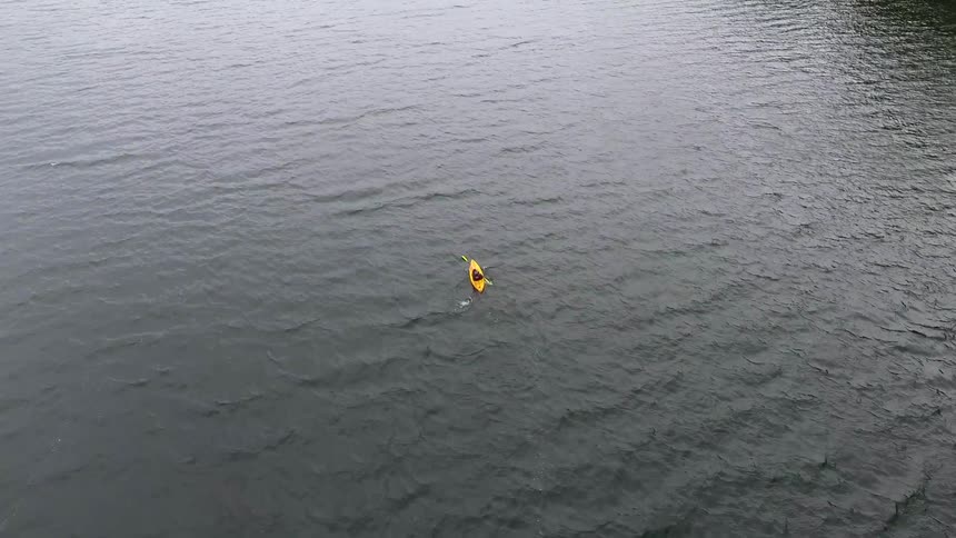Man Kayaking On Lake