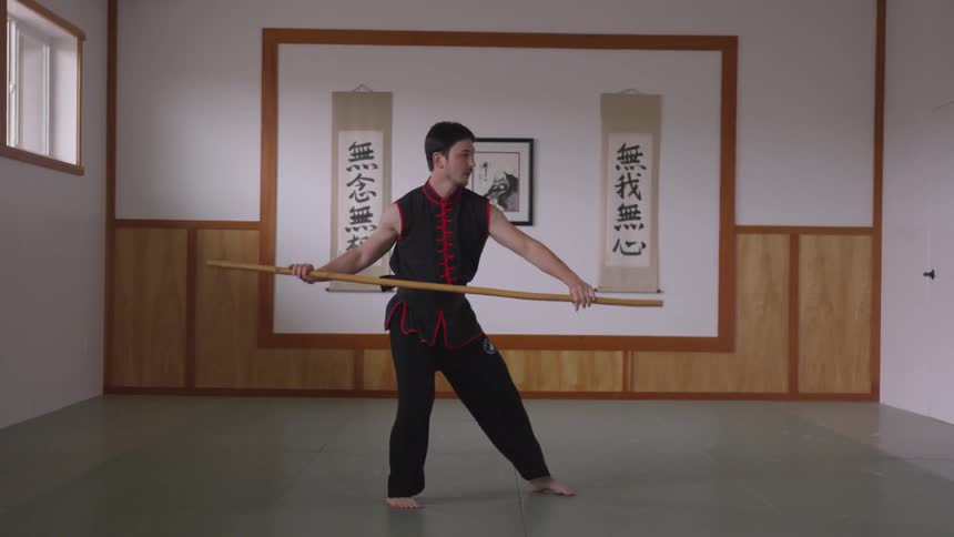 Man Practicing Asian Fighting Techniques