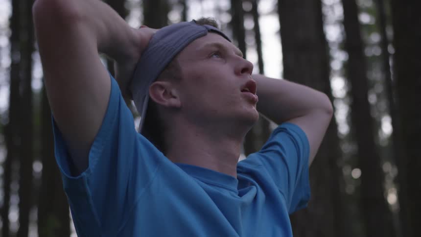 Man Jogging Through Forest
