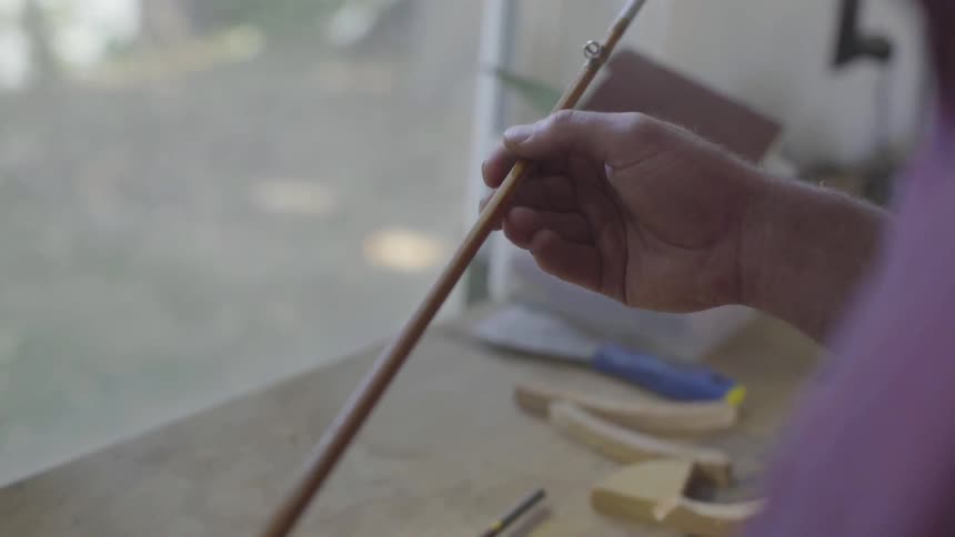 Man Making Fishing Pole