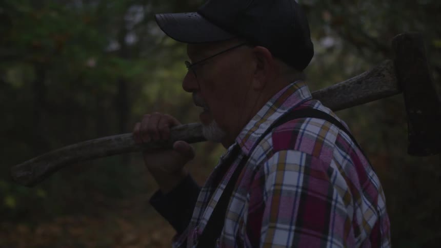 Man In Forest With Weapons