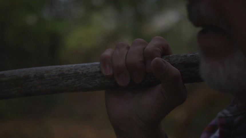 Man In Forest With Weapons