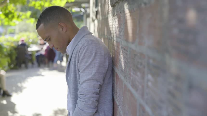 Man Praying And Talking On The Phone