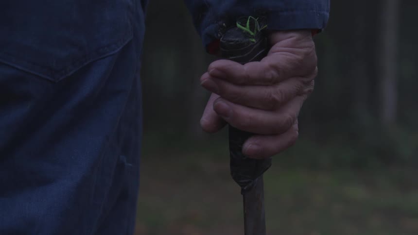 Man In Forest With Weapons